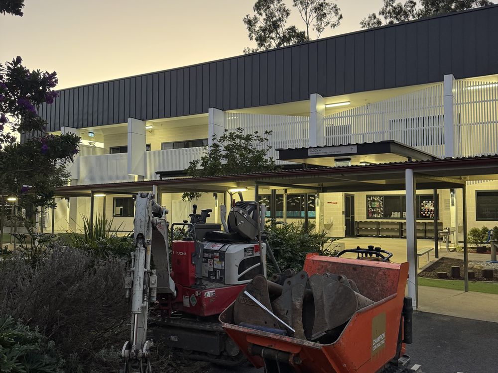 Compact excavator working on a small commercial site